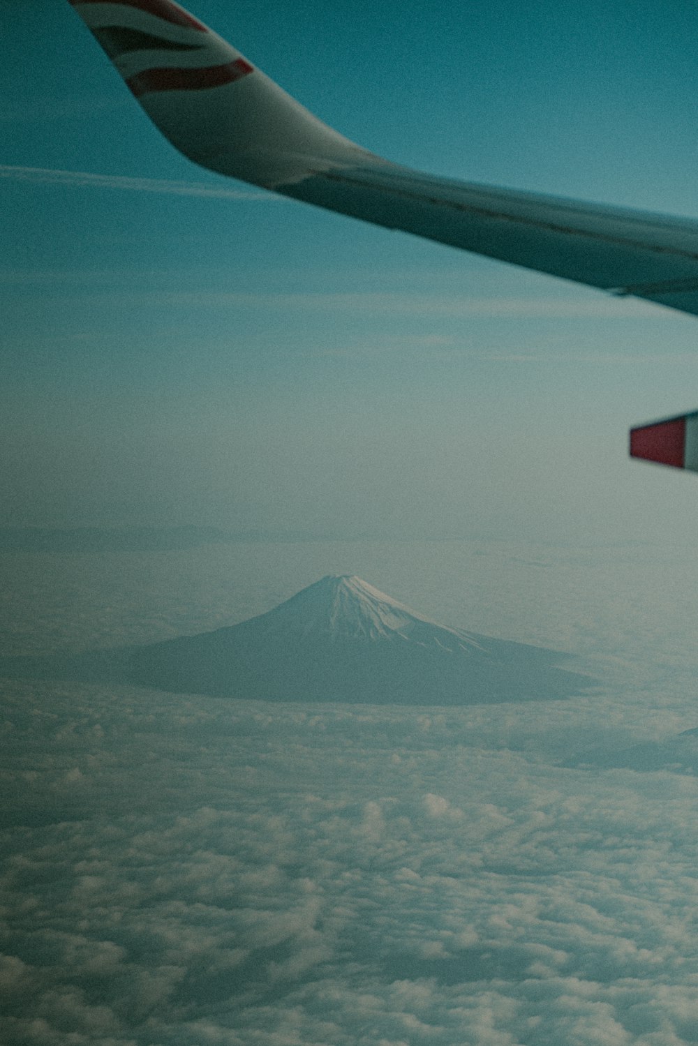 a view of a mountain from an airplane window