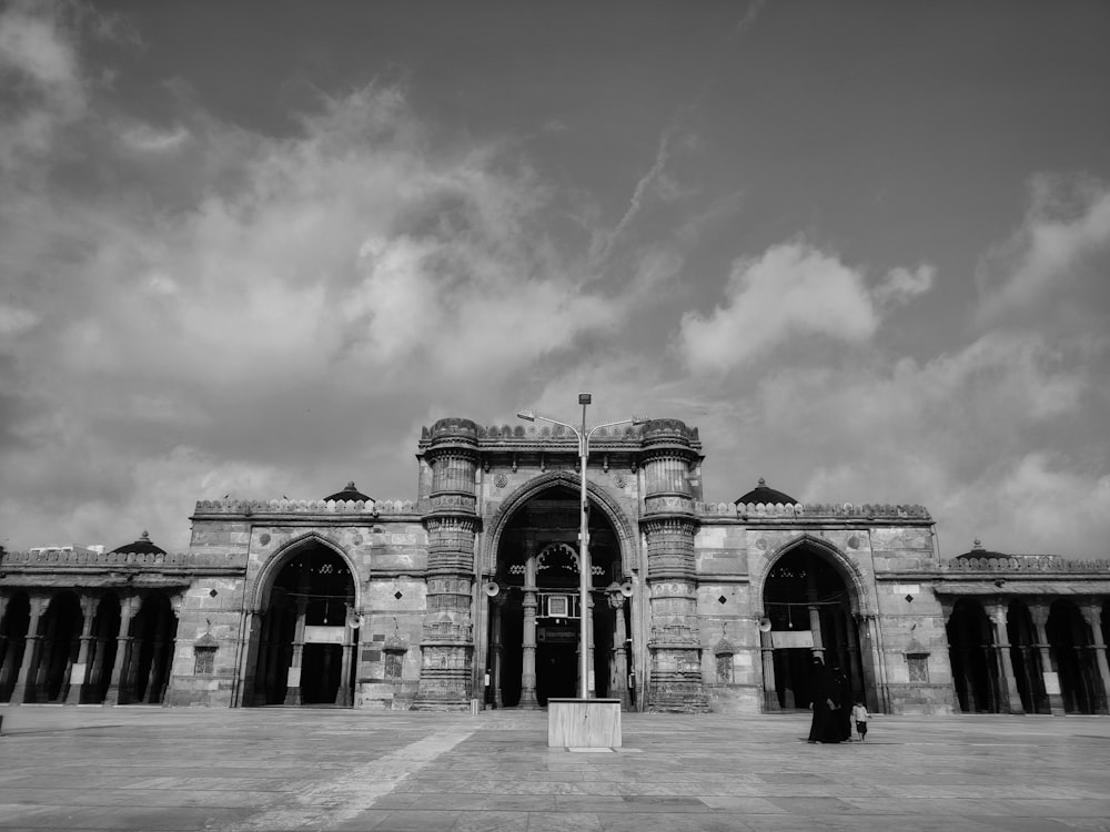 a black and white photo of a large building