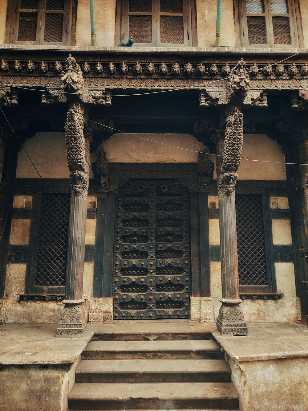 an old building with a bunch of stone pillars