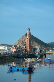 a group of boats floating on top of a body of water