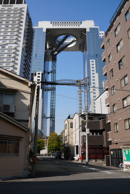a very tall clock tower towering over a city
