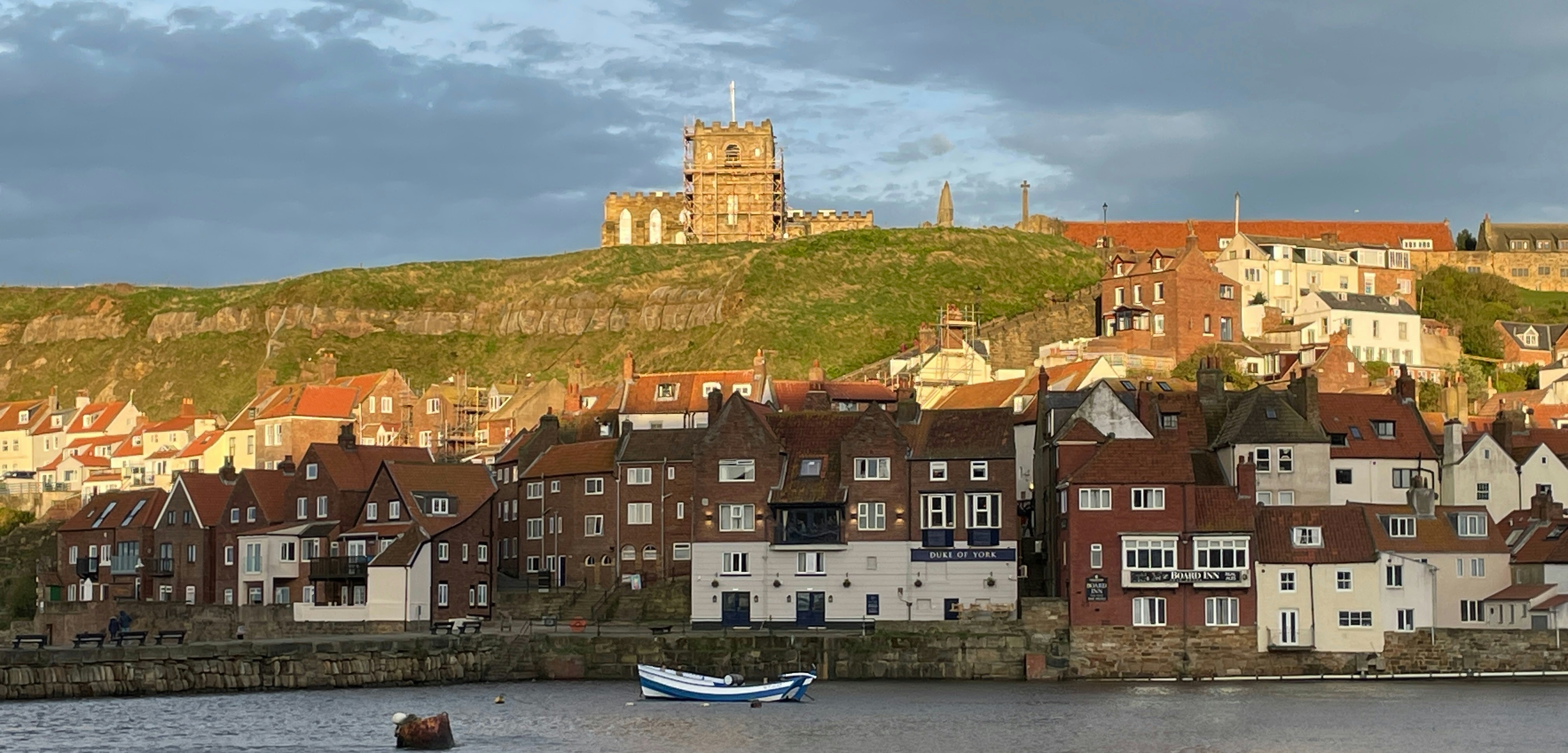 a row of houses next to a body of water