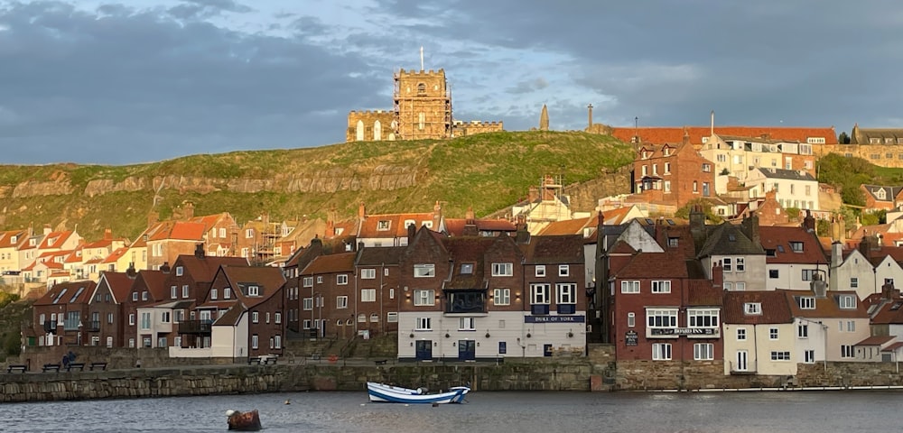 a row of houses next to a body of water