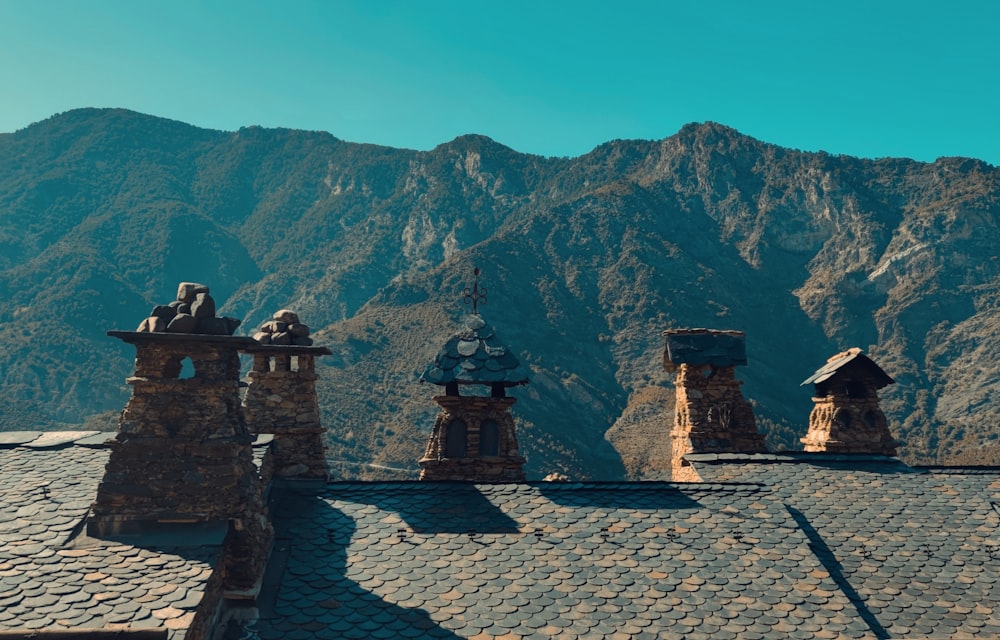 a view of a mountain range from a roof of a building