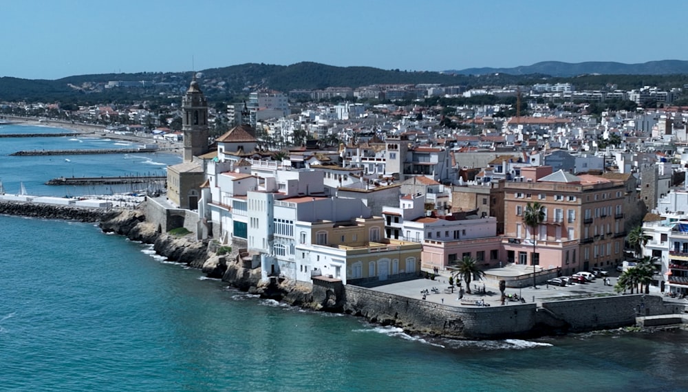 an aerial view of a city on the water