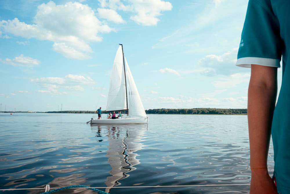 a person standing on a boat in the water