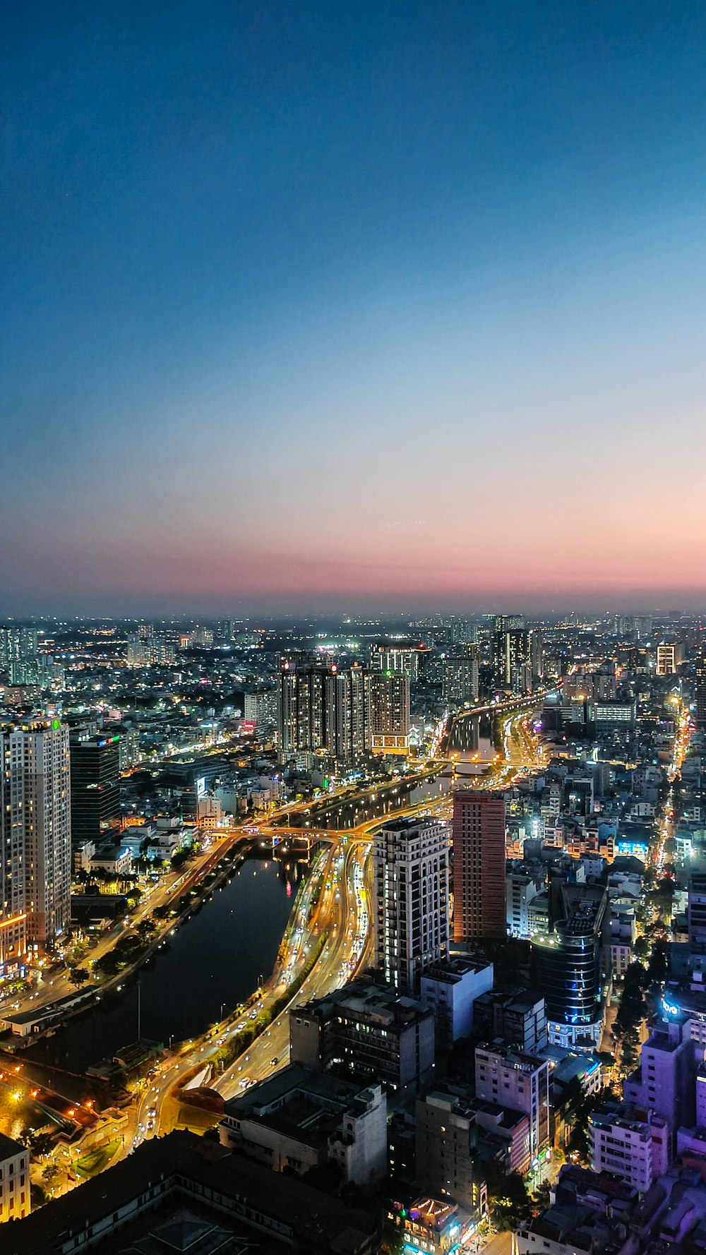 a view of a city at night from the top of a building