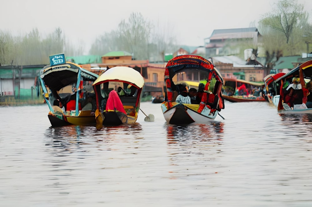 a group of boats floating on top of a river