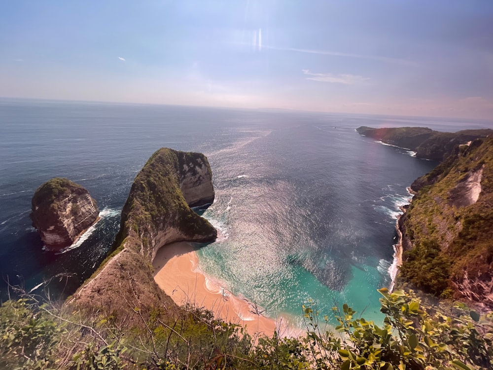 a view of the ocean from the top of a hill