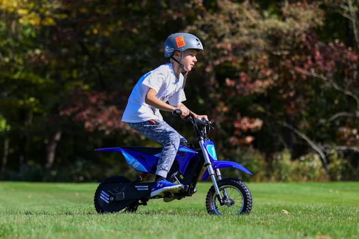 Young rider on an electric mini dirt bike