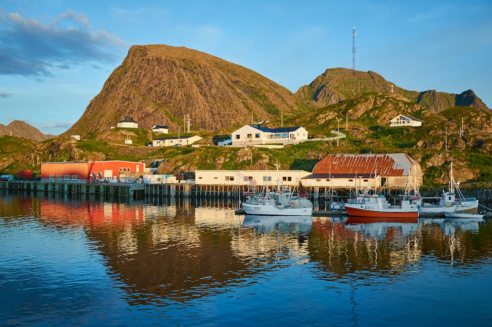 a group of boats floating on top of a body of water