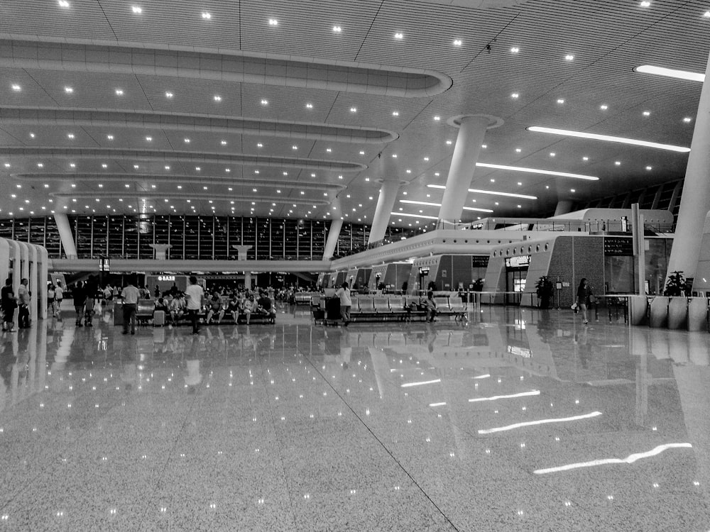 a black and white photo of an airport terminal