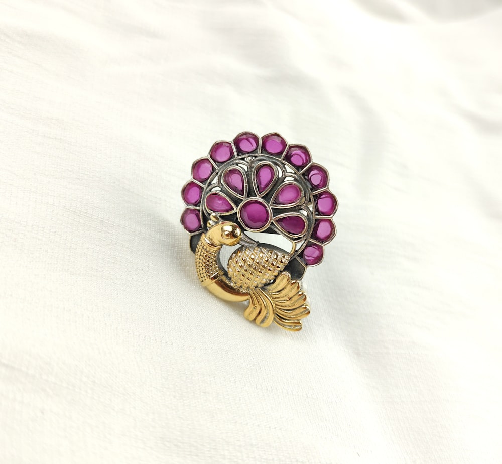 a ring with a bird on top of it