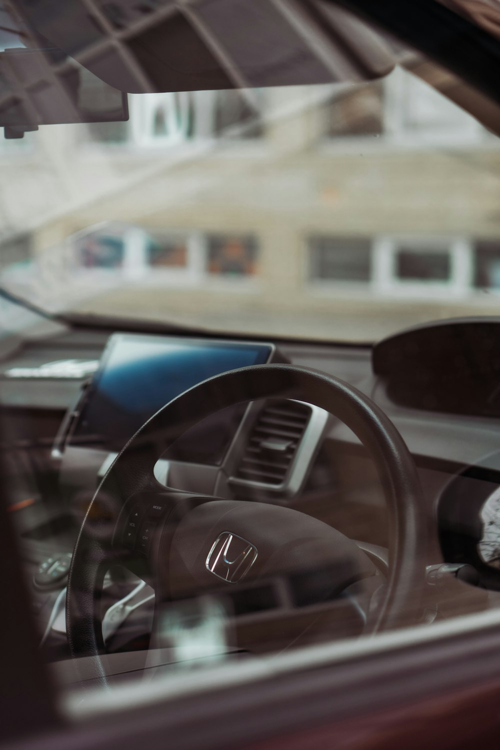 the interior of a car with a steering wheel