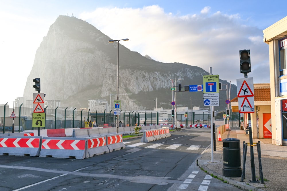 a street with a mountain in the background