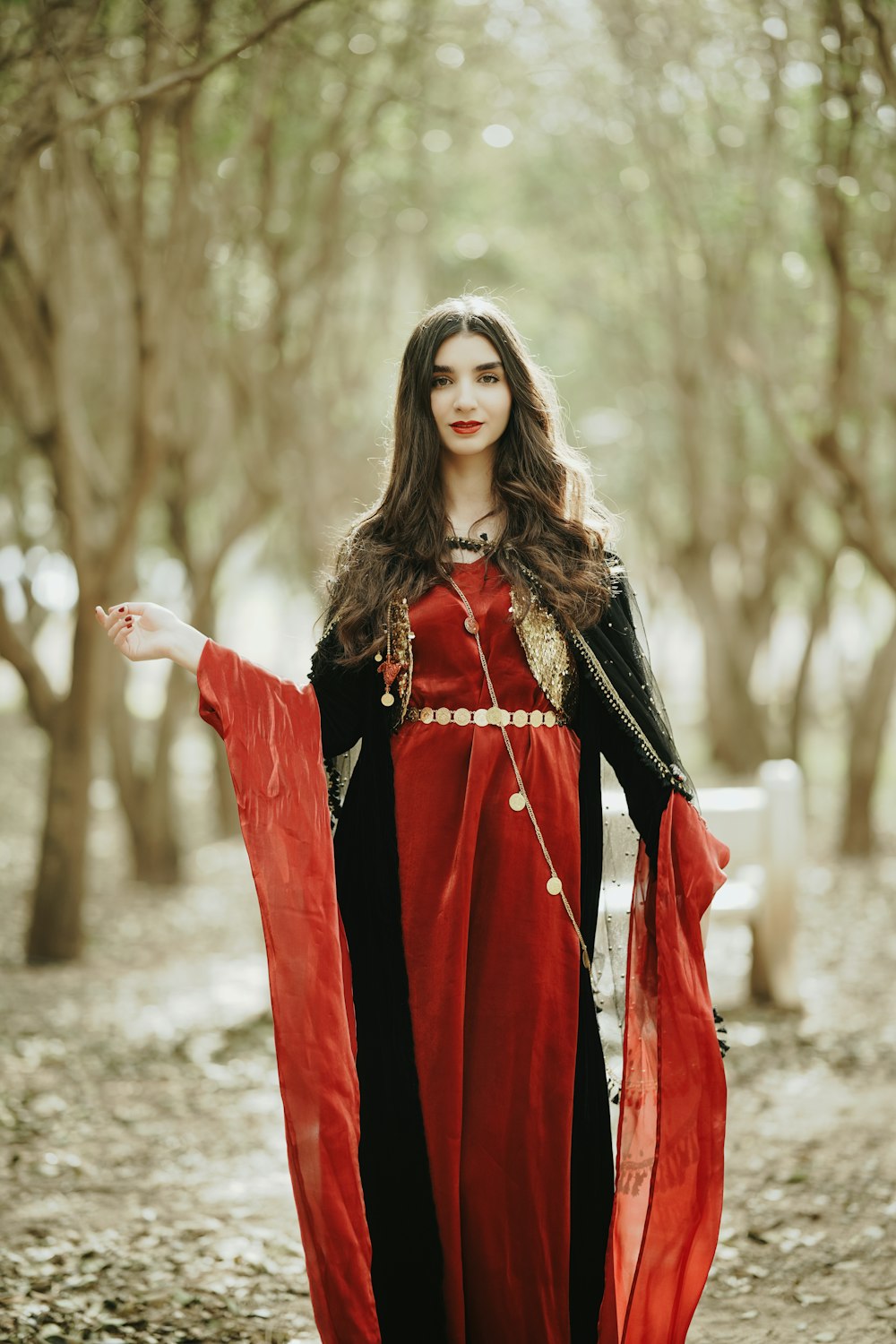 a woman dressed in a red and black costume