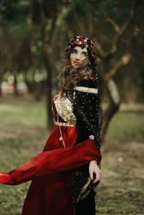 a woman in a red and black costume