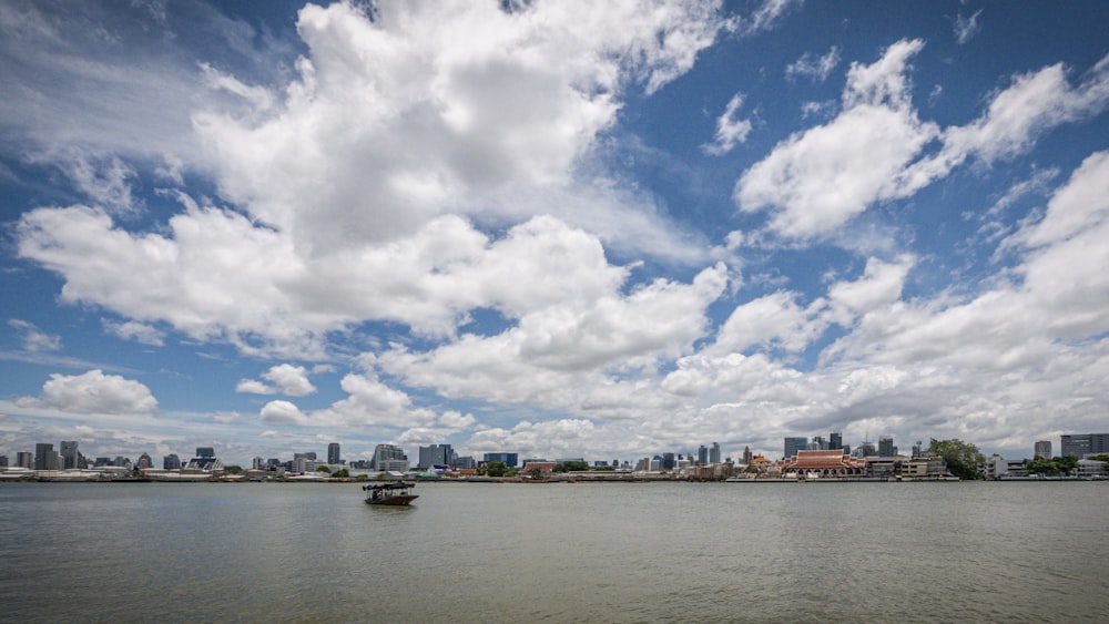 a boat floating on top of a large body of water