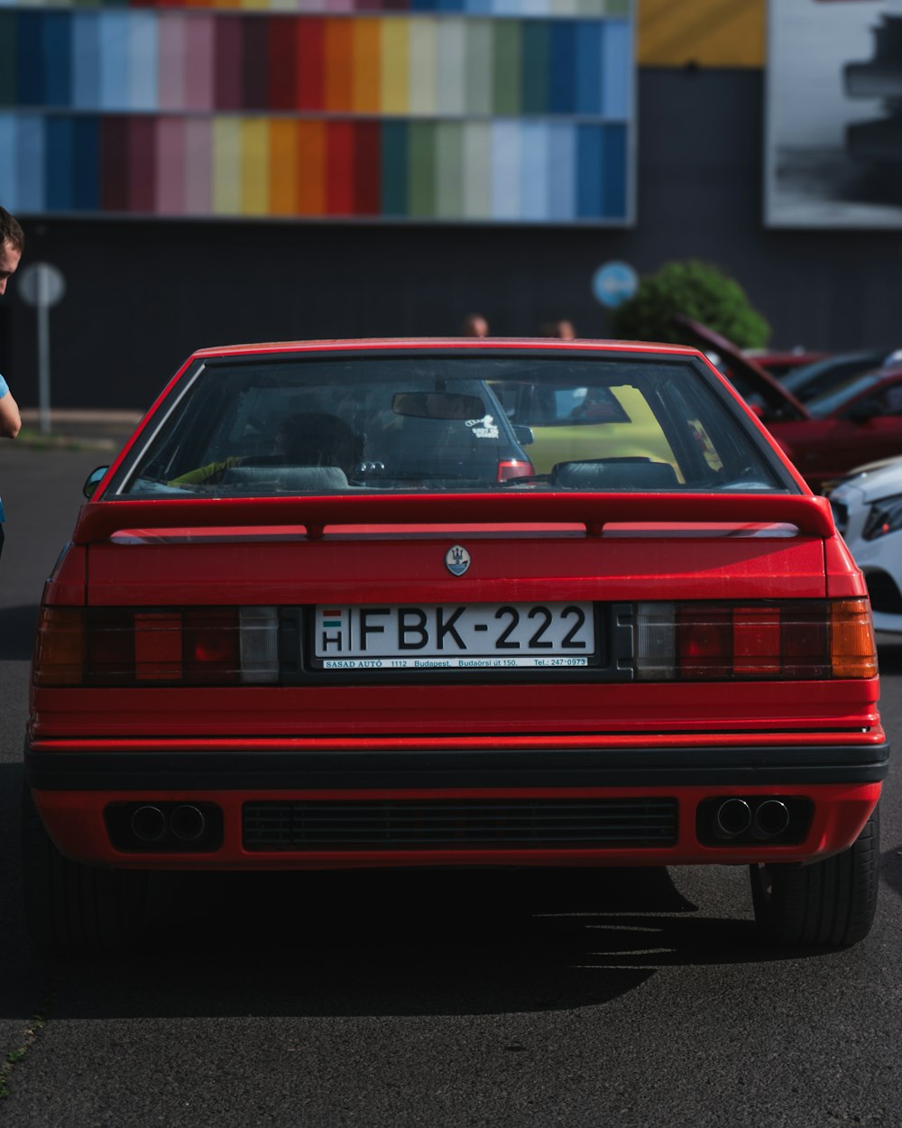 a red car parked in a parking lot