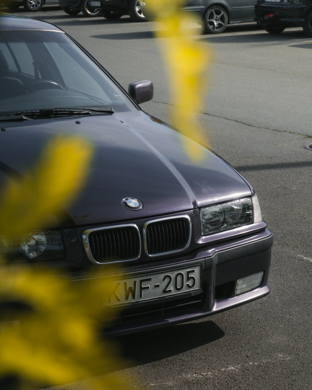 a black car parked in a parking lot