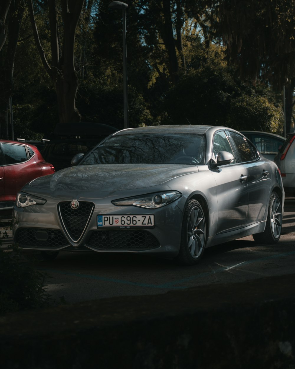 a silver car parked on the side of the road