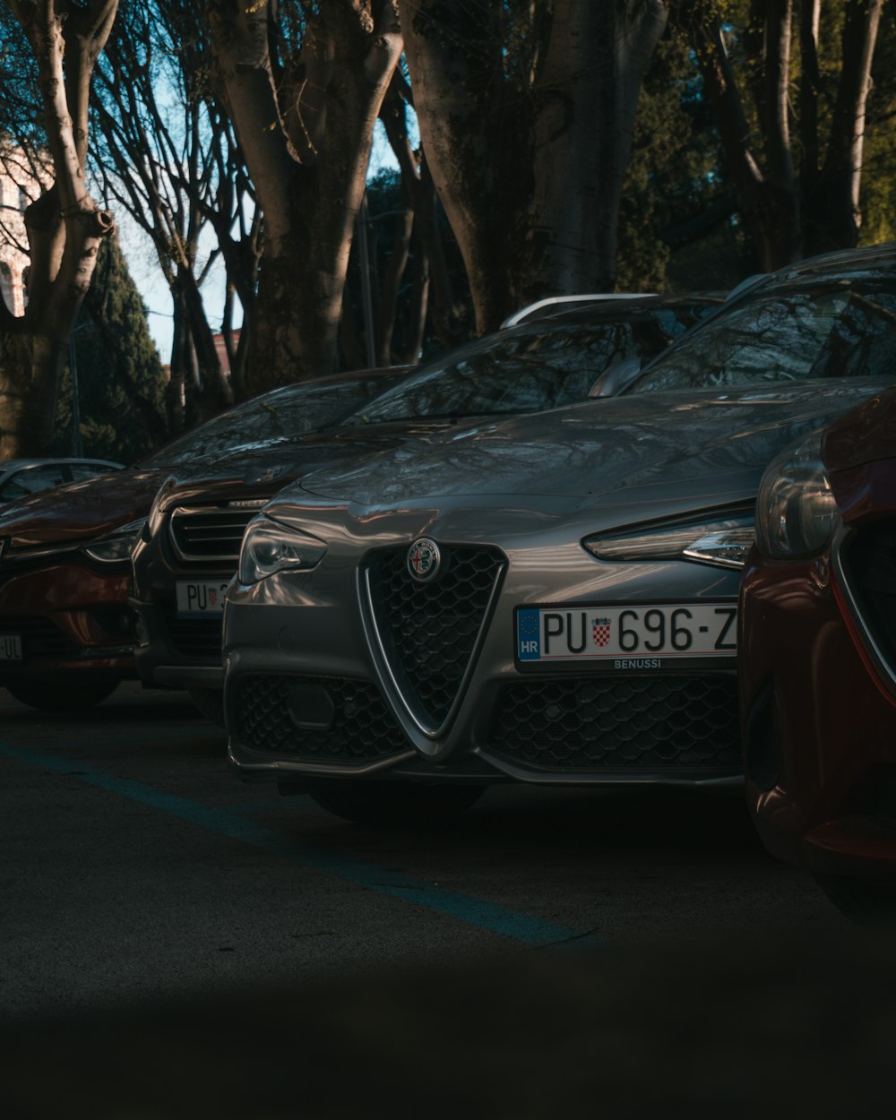 a row of parked cars in a parking lot