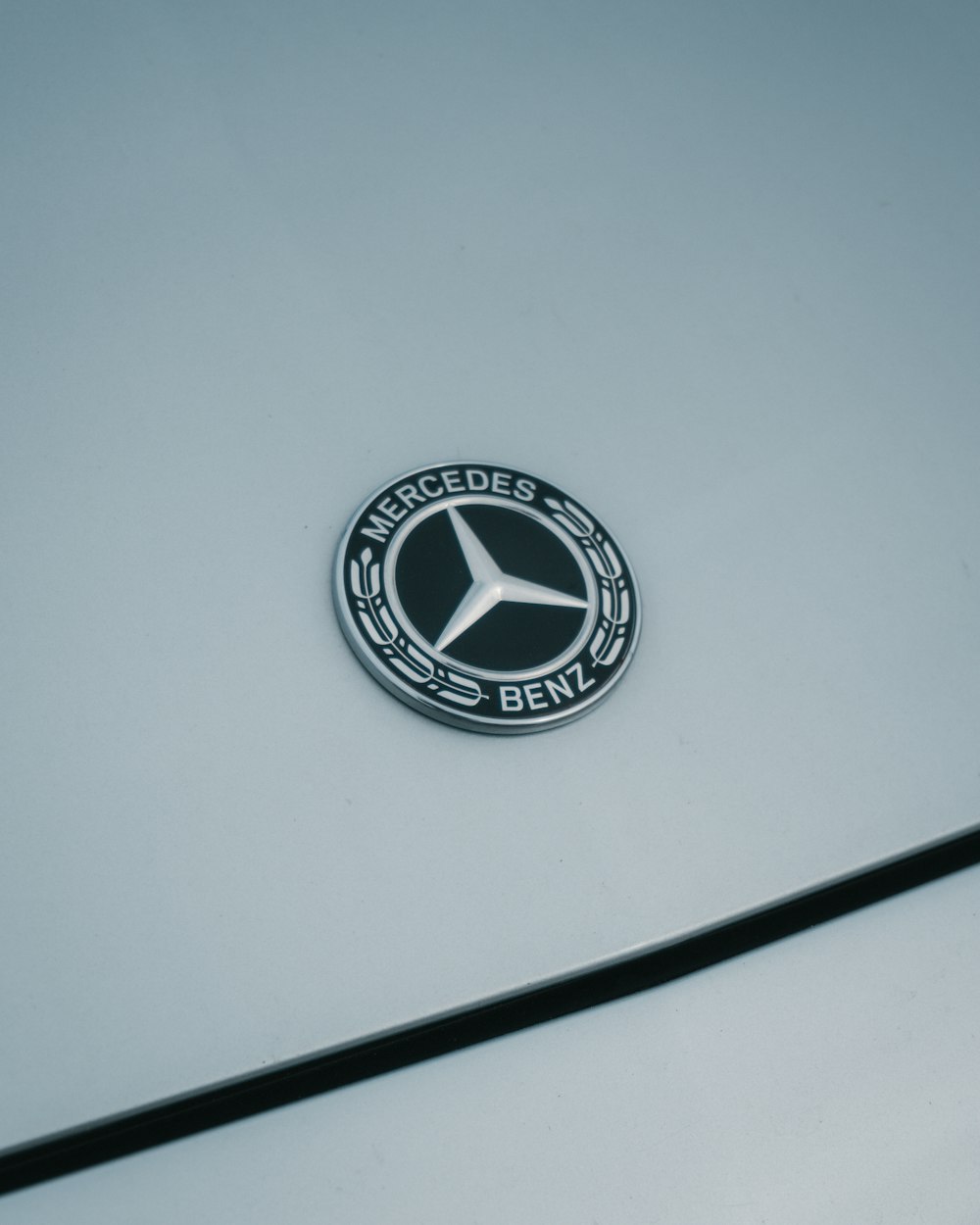 a mercedes emblem is shown on the side of a car