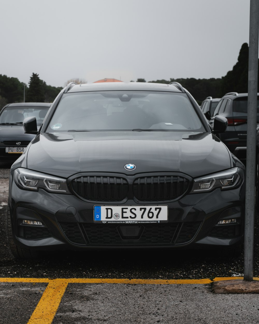 a grey car parked in a parking lot