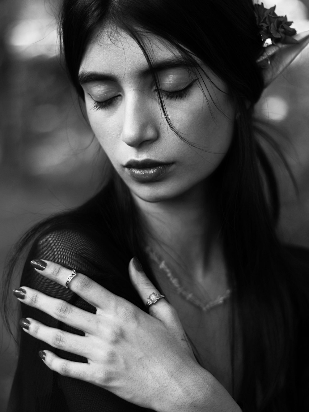 a woman with a flower in her hair