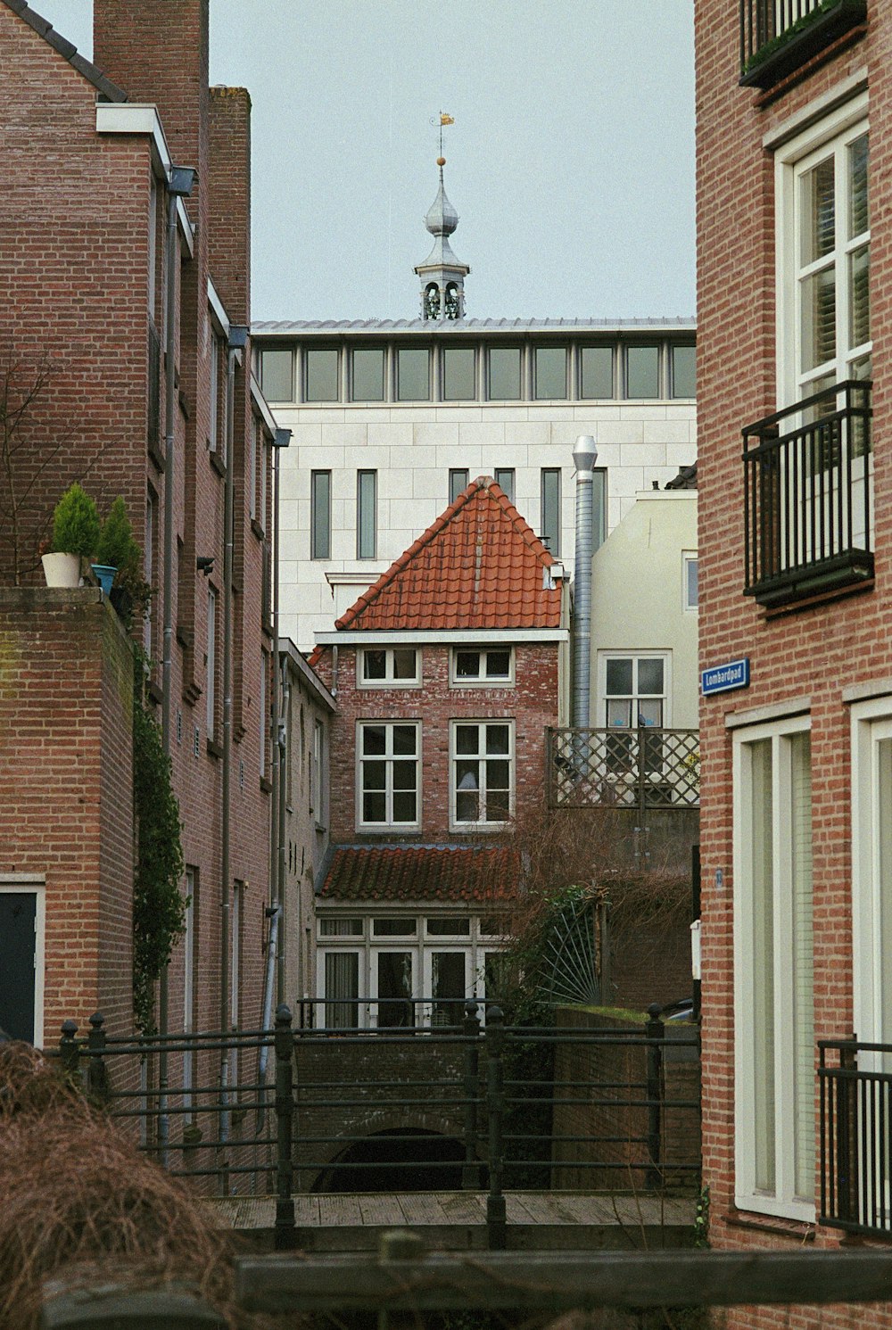 a building with a clock tower in the background