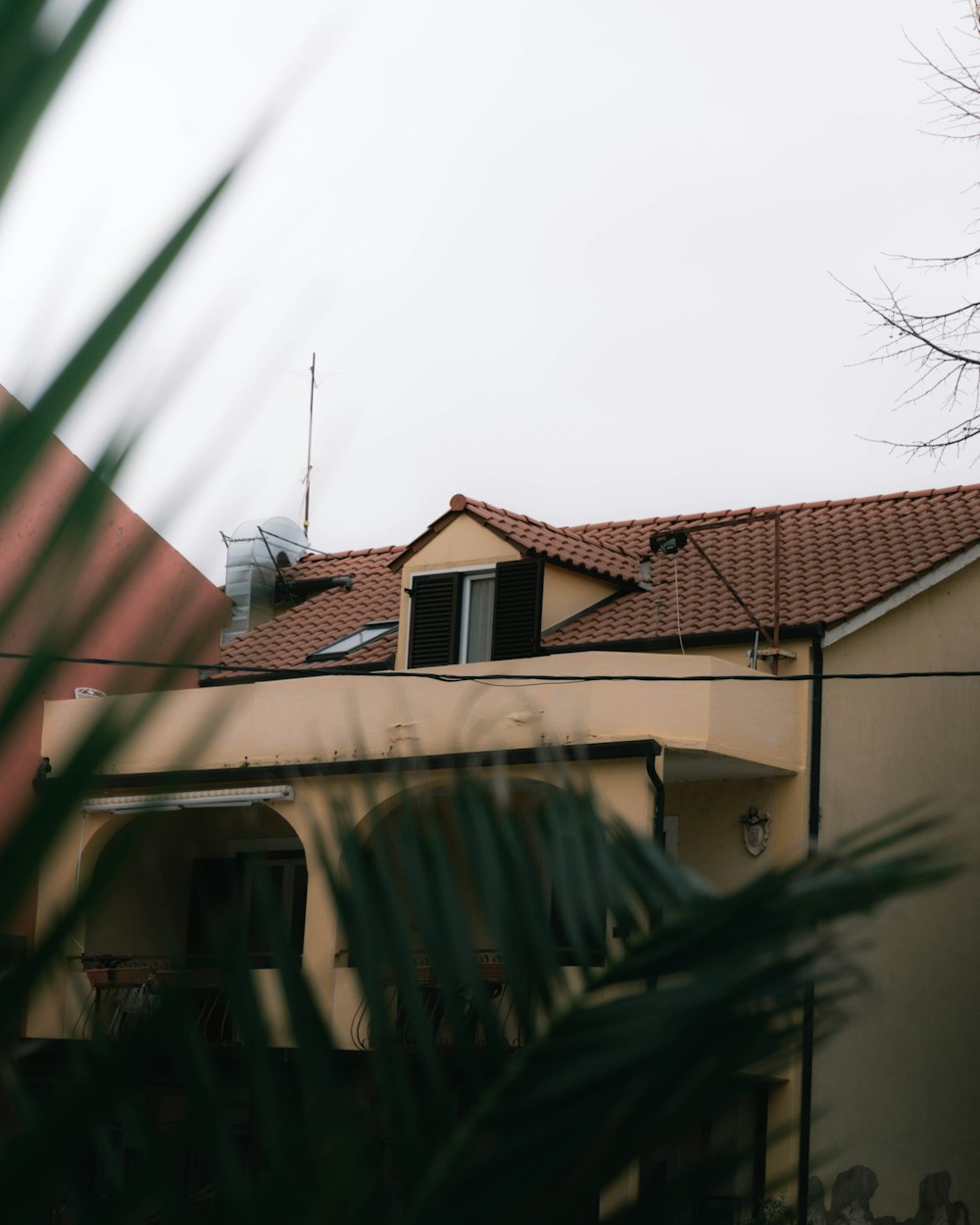 a house with a roof with a red tile roof