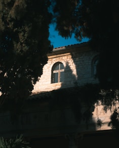 a building with a cross on the top of it