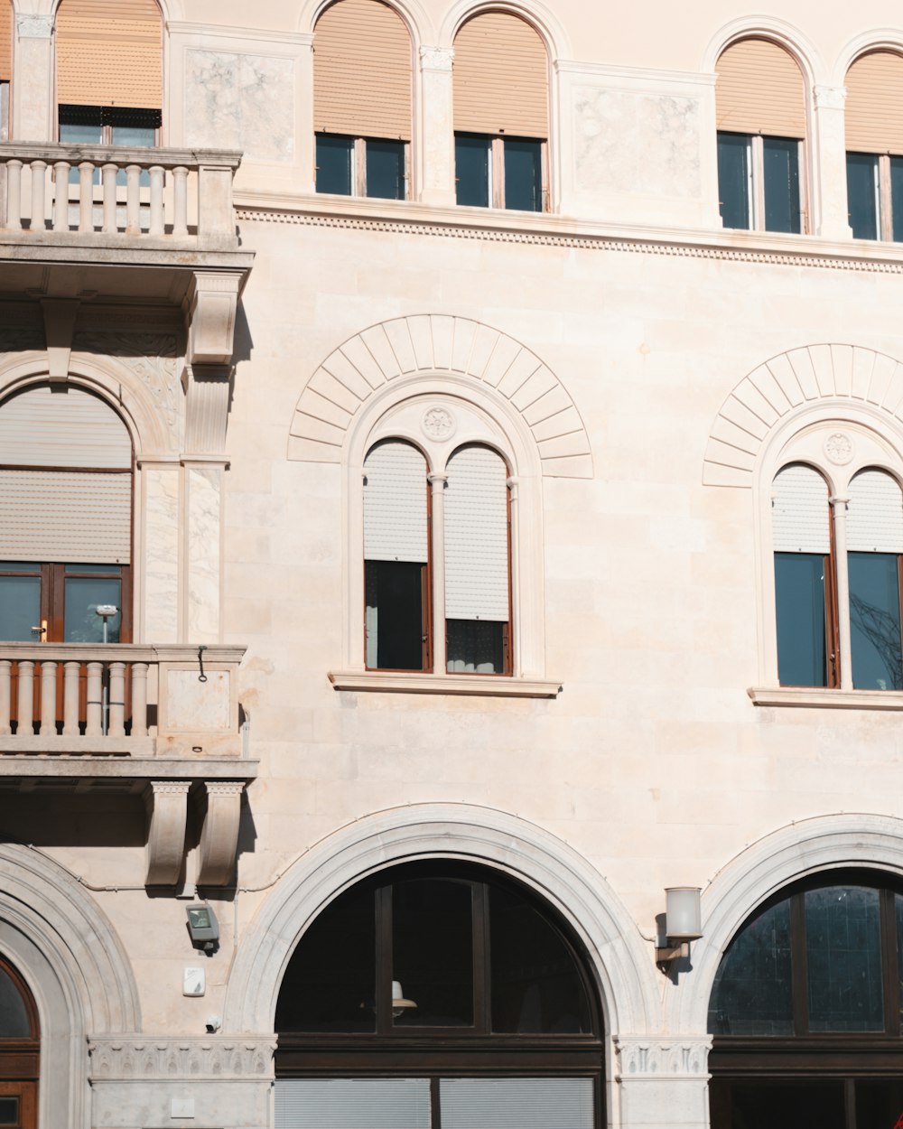 a large white building with a clock on the front of it