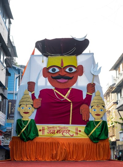 a large float of a man with a mustache