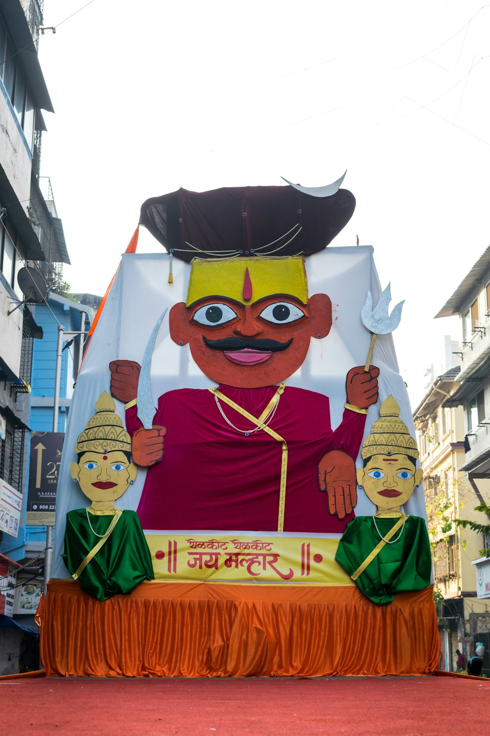 a large float of a man with a mustache