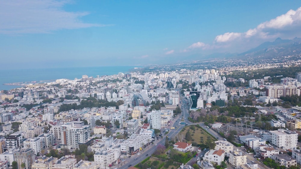 an aerial view of a city with lots of tall buildings