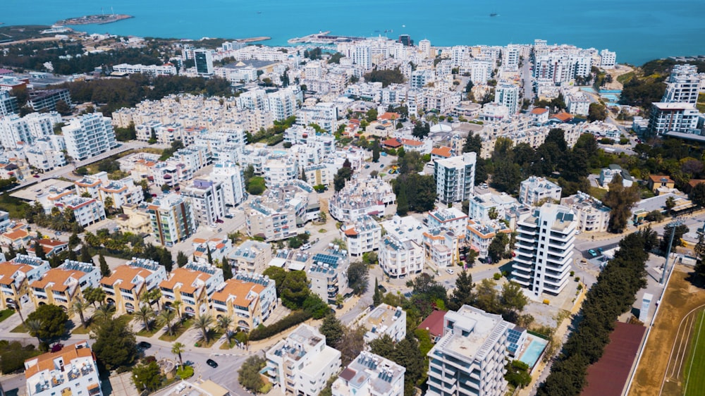 an aerial view of a city with lots of tall buildings