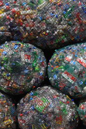 a pile of plastic bags filled with lots of trash