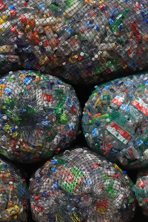 a pile of plastic bags filled with lots of trash