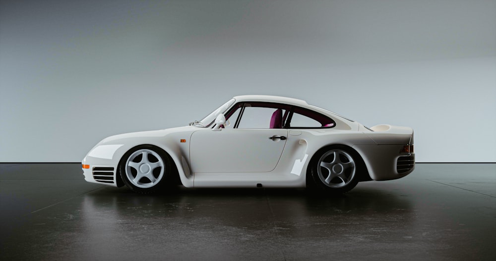 a white sports car parked in a garage