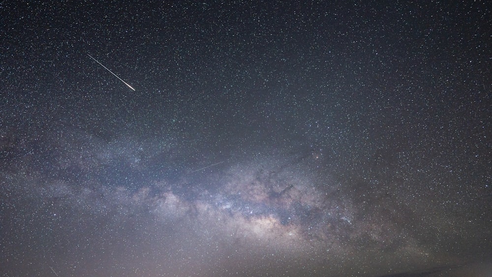 a view of the night sky with the milky in the background