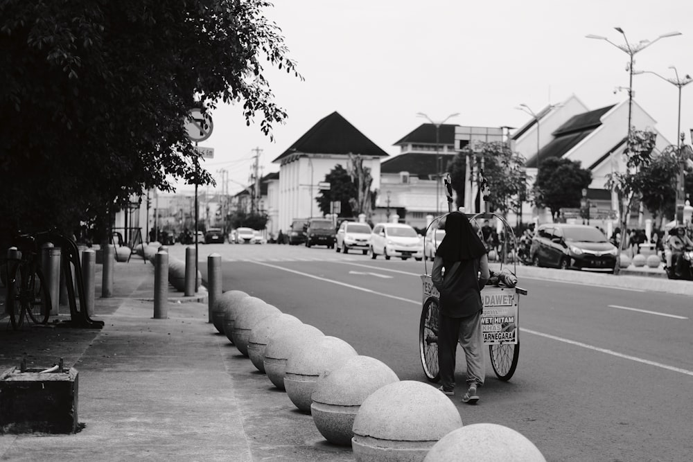 a person riding a bike down a street