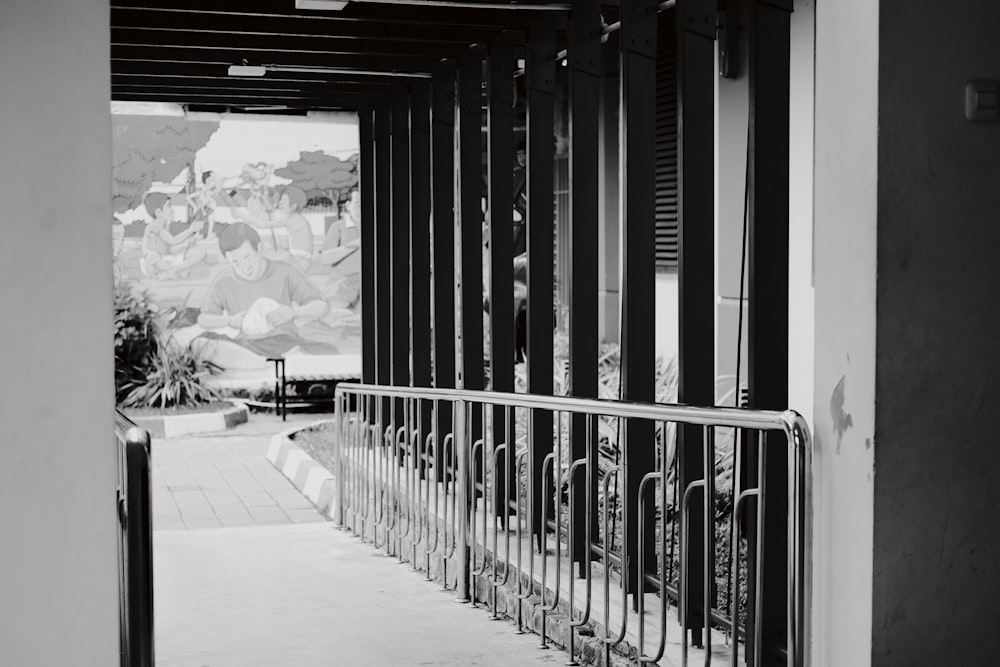 a black and white photo of a railing