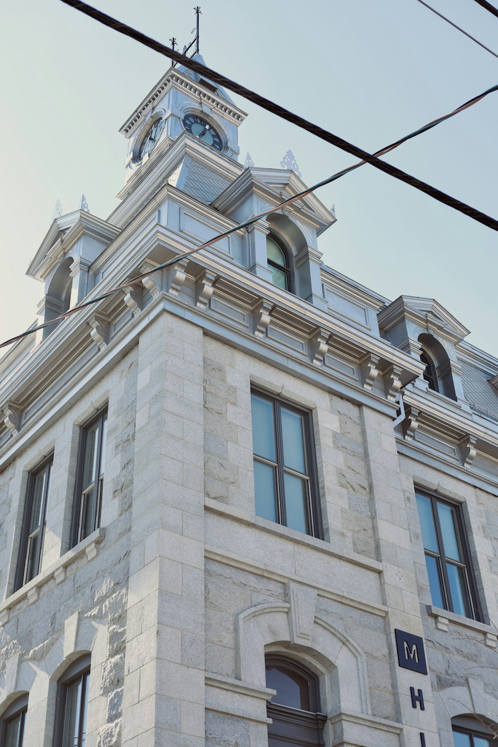 a tall building with a clock on the top of it