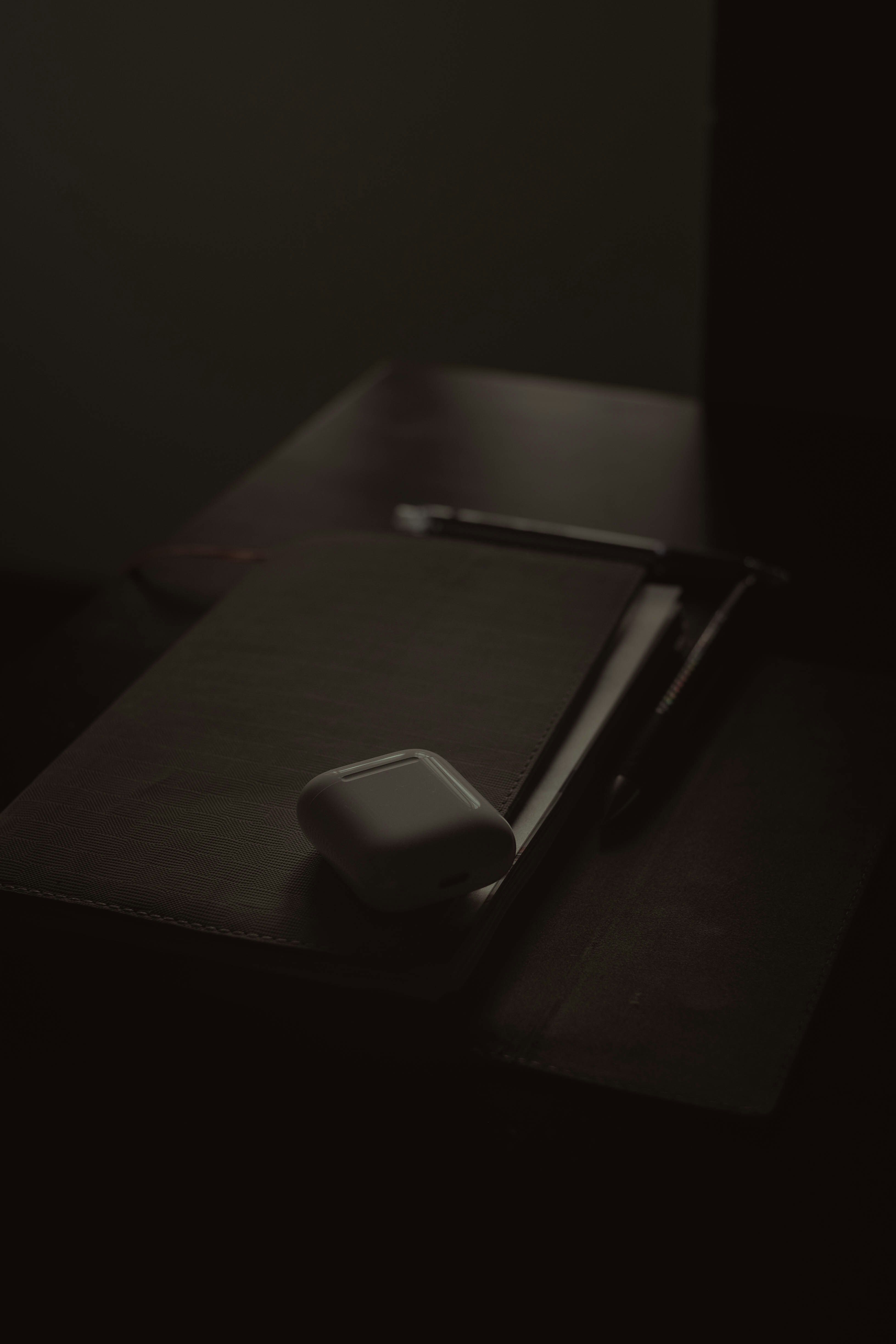 a mouse pad sitting on top of a wooden desk
