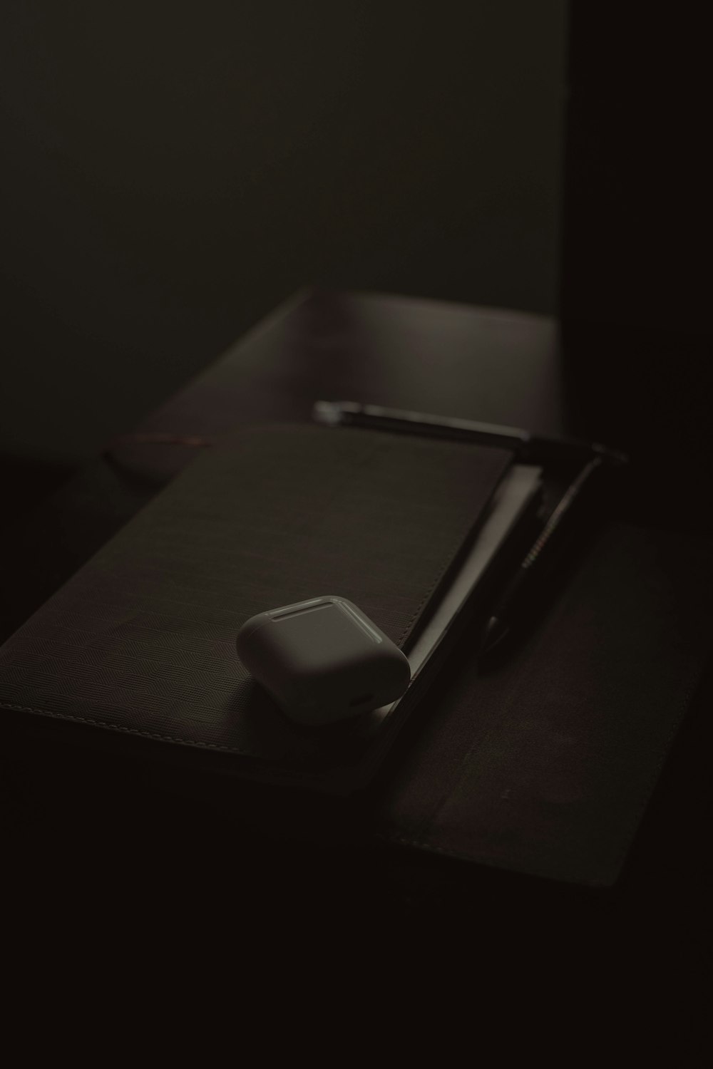 a mouse pad sitting on top of a wooden desk