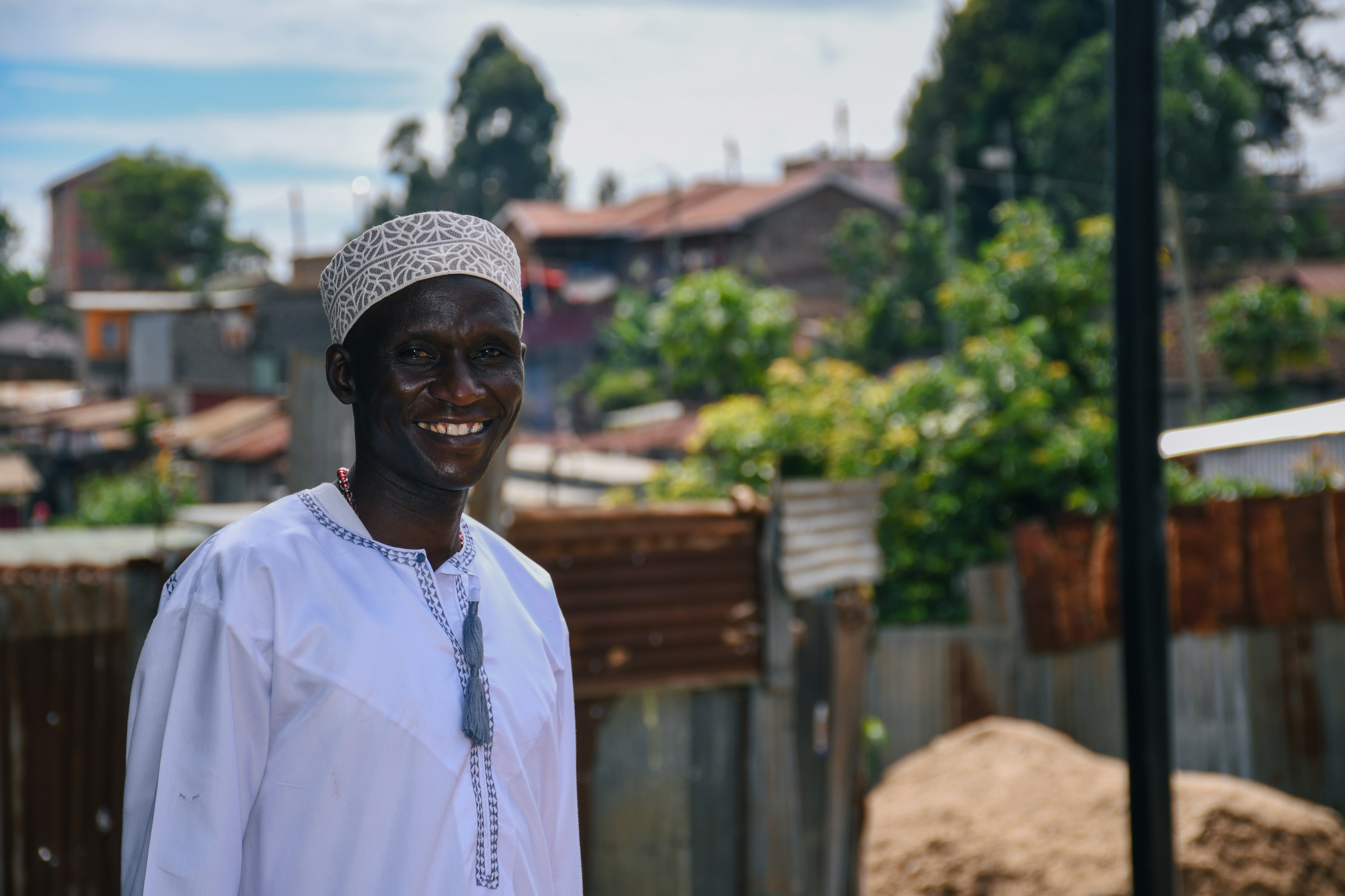 a man in a white shirt and a hat
