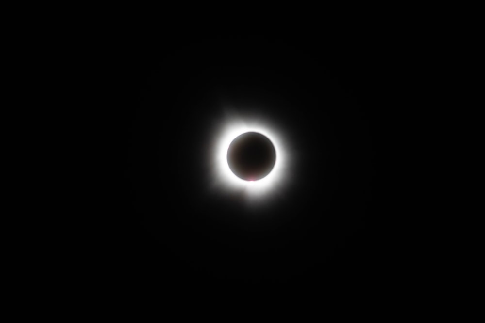 a solar eclipse is seen in the dark sky