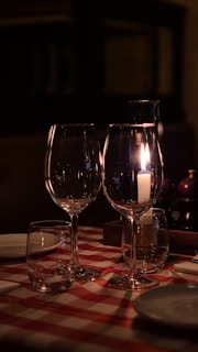 three wine glasses sitting on top of a table