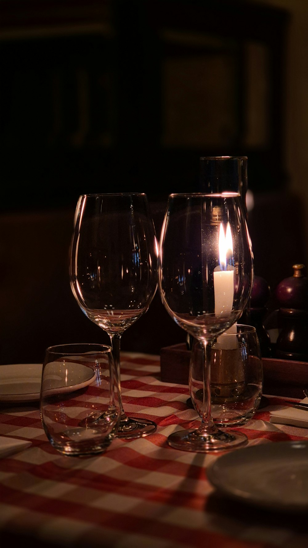 three wine glasses sitting on top of a table